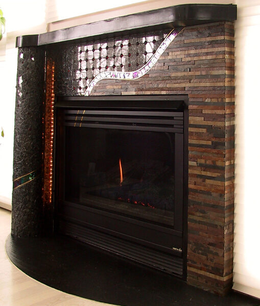 mosaic fireplace surround, slate, marble, glass beads, dichroic stained glass, major colors black and brown