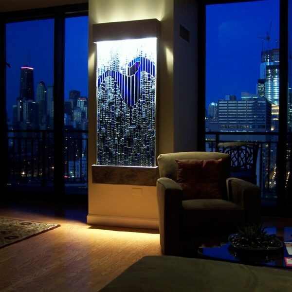 mosaic of glass tile, beads, dichroic tiles, monochromatic blue in room setting with Chicago skyline in background